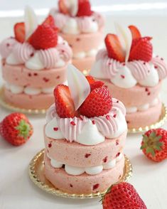 strawberry shortcakes with whipped cream and fresh strawberries on the top are ready to be eaten