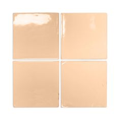 four square beige tiles on a white background