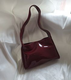 ✨ Elevate your style with our Burgundy Elegance handbag! ✨ Crafted from luxurious patent leather, this stunning accessory seamlessly combines sophistication with a touch of modern flair. The deep burgundy hue exudes confidence and versatility, making it the perfect companion for any occasion. 🌟 🎁 Perfect Gift: Surprise a special woman in your life with the Burgundy Elegance handbag - a timeless and elegant gift that will leave a lasting impression. Carry sophistication wherever you go with our Burgundy Elegance handbag. Embrace the confidence that comes with a stylish accessory that complements your unique personality. Order yours now and make a statement in every stride! 👜✨ Hello, Thank you for choosing to shop with us on Etsy! We appreciate your support and are thrilled to be able to Trendy Burgundy Tote Shoulder Bag, Trendy Burgundy Rectangular Satchel, Trendy Burgundy Rectangular Shoulder Bag, Retro Burgundy Shoulder Bag, Retro Burgundy Shoulder Bag For Everyday, Retro Burgundy Shoulder Bag For Daily Use, Retro Burgundy Rectangular Bag, Retro Burgundy Bags For Daily Use, Trendy Burgundy Shoulder Bag With Removable Pouch