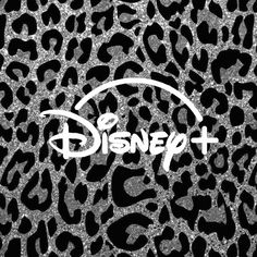 the disney logo on top of a black and white leopard print background