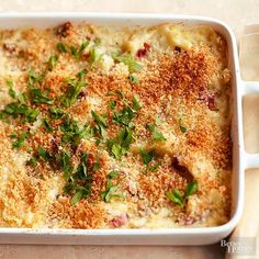 a casserole dish with cheese and herbs