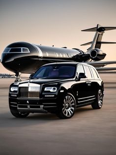 a rolls royce parked in front of an airplane