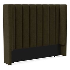 an upholstered headboard with dark green fabric and black metal posts on the sides