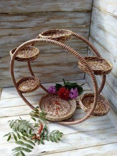 an arrangement of baskets with flowers in them