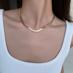 Available in two different sizes, The Snake Choker lies flat on your skin and gleams whichever way the light catches Effortlessly pairs with anything you own. Material: Platinum or Gold-plated Copper, Cubic Zirconia Weight: 16g / 6.6g Size: Wide 17.5 inches with a 2 inch adjustor / Fine 16 inches with a 2 inch adjustor Gold Snake Necklace, Snake Choker, Necklace Snake, Gold Snake Chain, Antique Jewellery Designs, Snake Chain Necklace, Snake Necklace, Gold Choker, Gold Snake