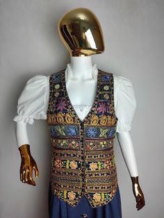 STEFANEL vintage women's embroidered vest Very good condition Size tagged 42, fits like S (please check measurements) Composition: 100% viscose Measurements: Pit to pit - 18.1″ / 46 cm Back length - 22.8″ / 58 cm *All measurements are taken with the garment laying flat #2642 Embroidered Sleeveless Vest For Fall, Sleeveless Embroidered Vest For Fall, Fitted Patchwork Vest For Festival, Bohemian Sleeveless Vest With Patchwork, Bohemian Patchwork Sleeveless Vest, Bohemian Sleeveless Patchwork Vest, Sleeveless Vest For Fall Festival, Embroidered Festival Vest, Embroidered Sleeveless Vest For Festival