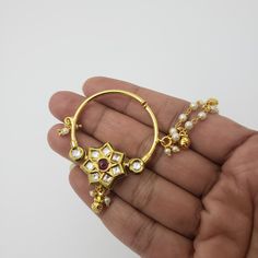 "The nose stud or the nose ring, also commonly known as \"The Nath\" has been an essential and integral part of the Indian culture and religion. This traditional Kundan nose ring / Nath is designed for special occasions like weddings, parties, and functions. It requires NO piercing, just press it, and you are done. Measurements: An end to end is 8 inches; Round Nose ring inner measurements: 1.25 inches Color, shades, texture displayed may slightly vary from the actual product due to digital imag Pressing Nose Ring, Round Nose Ring, Nose Ring Indian, Ring Indian, Round Nose, Indian Culture, Indian Wedding Jewelry, Nose Ring Stud, Nose Stud