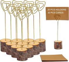 there are many pieces of wood on the table with place cards and holders for each piece