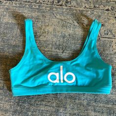 Size S Nwot Never Even Tried On Super Cute Light-Medium Support Aqua Blue Not Made Anymore In This Style/Color Alo Yoga Bra-friendly Activewear For Sports, Alo Yoga Sports Activewear, Bra Friendly, Summer Workout Activewear By Alo Yoga, Alo Yoga Summer Workout Activewear, Alo Yoga Sporty Summer Activewear, Sporty Alo Yoga Activewear For Summer, Alo Yoga Summer Activewear For Yoga, Alo Yoga Summer Gym Tops, Casual Seamless Activewear By Alo Yoga