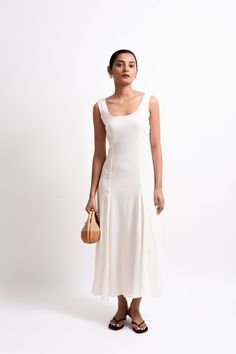 The Ayrah Dress is a stunning maxi featuring a low round neckline in front and back, sleeveless design, and a fitted bust and waist that gracefully flares into a voluminous skirt. Fully lined with a back zipper opening, this elegant dress is perfect for making a statement at any occasion. Chic A-line Maxi Dress With Lined Bodice, Chic A-line Maxi Dress With Bias Cut, Sleeveless Fit And Flare Midi Dress With Lined Bodice, Fitted Bodice Bias Cut Midi Dress, Fitted Bodice Midi Dress With Bias Cut, Bias Cut Midi Dress With Fitted Bodice, Fitted Square Neck Maxi Dress With Lined Bodice, Fitted Maxi Dress With Square Neck And Lined Bodice, Spring Maxi Dress With Back Opening And Fitted Bodice