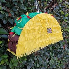 a taco sitting on top of a green bush