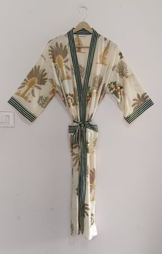 Cotton kimono robes are perfect for lounging around the home or spa.  Use our block print robe as a cover up on the beach or after a dip in the pool.  Add a luxe, boho feel to your bridal shower. Versatile, soft and luxurious, our 100% cotton kimono robes are printed with azo-free dyes. The block print floral robe features 3/4th sleeves, a waist tie and two front pocket. Beige Summer Sleepwear For Vacation, Summer Kimono Sleeve Sleepwear, Summer Sleepwear With Kimono Sleeves For Loungewear, Summer Sleepwear With Kimono Sleeves, Summer Wrap Robe For Lounging, Summer Lounging Wrap Robe, Beige Floral Print Beach Kimono, Long Summer Robe For Lounging, Long Summer Lounging Robe