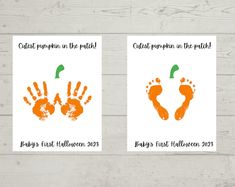 two handprinted cards with orange and green prints on them, one is for baby's first halloween