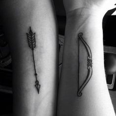 two people with matching tattoos on their arms, one has an arrow and the other has a bow