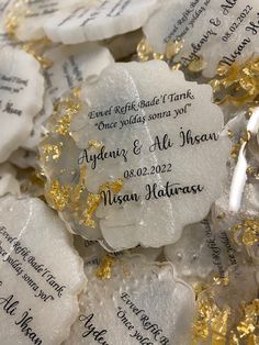 white and gold wedding favors with names on them