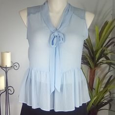 Beautiful Elle Sleeveless Blouse, Sheer, Light Blue, Chiffon Feel, Peplum Fit, Lace Accents At Neckline (Front And Back), Gathered Waist, 25" From Shoulder To Bottom Hem, 18 1/2" From Armpit Seam To Armpit Seam This Is A Bogo Free Item, Add As Many Buy One Get One Free Items As You Like To A Bundle And I Will Send You The Discount In An Offer. Buy One Get One Free, Buy One Get One, Sheer Blouse, Free Items, Sleeveless Blouse, Bow Tie, Top Blouse, Light Blue, Chiffon