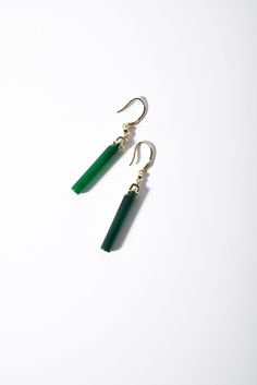 A pair of lovely long green jade earrings comes with gold hooks. Made with quality long and cubic emerald-like green hanging jade drops. The minimalist design suits most occasions. Some highlights of this elegant and fancy dangle silver jade earrings are: *High-quality materials Quality green jade, delicate carving details, 925 sterling silver. Makes a perfect gift for yourself or friends. *Simple style Simple but basic design suits many occasions and works great on many outfits. *Measurements E Green Jade Earrings For Pierced Ears, Single Green Long Drop Earring, Green Single Long Drop Earring, Jade Drop Earrings With Ear Wire, Green Long Drop Earrings, Handmade Jade Drop Earrings, Green Minimalist Pierced Earrings, Minimalist Green Pierced Earrings, Green Long Drop Earrings As Gift