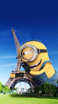 a minion in front of the eiffel tower