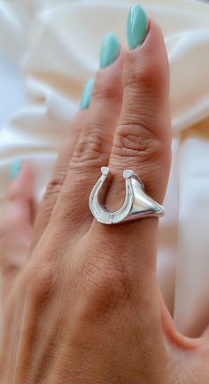 "Product Description: Presenting our Handmade Sterling Silver Horse Shoe Signet Ring, a animal inspired piece of jewelry that is meticulously crafted for horse lovers. This ring showcases a round and radiant horse shoe design, symbolizing the beauty and mystique of the horses world. Made with sterling silver, this ring exudes elegance and sophistication while offering durability that will withstand the test of time. With its minimalist style, it is suitable for any occasion, adding a touch of si Silver Adjustable Horseshoe Rings, Silver Horseshoe Ring As Gift, Silver Horseshoe Ring For Gift, Horse Shoe Design, Horse Shoe Ring, Full Moon Ring, Horse Ring, Charm Ring, Silver Horse