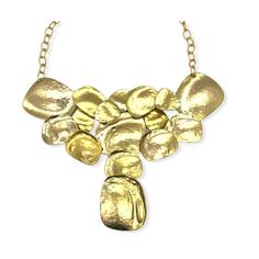 Vintage brutalist style bib necklace by designer Kenneth J Lane. Statement necklace features large interconnecting flat discs of hammered gold plated metal. It has a plated open link chain with large hook closure. The necklace is deadstock and had its original hangtag and price of $150. Unworn condition. Note that the necklace was hand crafted and does show slight variation in color, bubbles and marks in the plating. This is consistent with the piece and should not be considered flaws. Please se Gold-tone Hammered Metal Necklace, Modern Hammered Metal Necklace, Gold Metal Bib Necklace With Adjustable Chain, Gold Metal Bib Necklace, Hammered Gold Metal Necklaces, Metal Bib Necklace With Adjustable Chain, Gold Hammered Metal Necklaces, Gold Hammered Metal Necklace, Purple Party