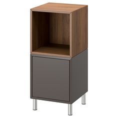 a small wooden cabinet with metal legs