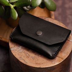 "This pouch wallet/purse this 100% handcrafted in Lincoln, UK. Made from a single piece of high-quality 5/6oz (2.5mm) full-grain leather this rugged yet classic design will keep your coins, cash and card secure.   With optional personalisation, this item is the perfect gift for Birthdays, Father's Day, Mother's Day or Anniversaries especially 3-year wedding anniversaries, LEATHER!  Shire Supply Company uses only the best quality leather, sourced from a UK-based tannery with over 100 years of lea Everyday Leather Coin Purse With Smooth Grain, Leather Coin Purse With Smooth Grain For Everyday Use, Leather Trifold Wallet With Waxed Finish For Everyday Use, Leather Bifold Coin Purse For Everyday Use, Everyday Leather Bifold Coin Purse, Handmade Black Trifold Wallet For Everyday Use, Daily Use Leather Bifold Coin Purse, Rectangular Leather Coin Purse With Smooth Grain, Leather Bifold Coin Purse For Daily Use