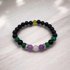 Force of Nature Bracelet Smooth Labor & Safe Birth W H A T ' S   I N T H E   P A C K A G E ? 1. Lava Stone Diffuser Bracelet (Malachite, Peridot, Moonstone, Lepidolite, Black Tourmaline, Lava Stone) 2. 25 drops of Organic Clary Sage in Glass Dropper 3. Gemstone info card 4. "How to use this bracelet" instructions **NOT RECOMMENDED UNTIL PREGNANCY IS CONSIDERED FULL-TERM** 1mm elastic stretch bead cord DOUBLE STRANDED **Standard size bracelet for women (7.5 inches) will be made unless otherwise s Black Amethyst Beaded Bracelets Spiritual, Spiritual Black Amethyst Beaded Bracelets, Black Amethyst Gemstone Bracelets, Black Amethyst Gemstone Bracelet, Black Amethyst Bracelet As Gift, Black Amethyst Crystal Bracelet In Spiritual Style, Bracelet Malachite, Bracelet Instructions, Stone Diffuser