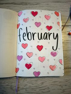 an open notebook with hearts and the word february written on it