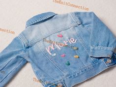 "Celebrate Your Little One's Style with the Baby & Toddler Personalized Denim Jacket. Infused with Love and Denim Elegance, This Customizable Jacket Makes the Perfect Gift for Birthdays, Baby Showers, or Any Special Occasion. 🌟 Key Features: Handcrafted, Personalized Jacket, Jean Jacket Distinctive and Personalized: Tailored with your child's name, this jacket adds a unique and personal touch to their wardrobe. 🌈 Versatile: Ideal for both special occasions and everyday wear, this jacket effortlessly elevates any outfit. 👶 Durable Design: The oversized fit ensures prolonged wear, providing year-long enjoyment for your child. 🌳 Wide Size Range: Available in various sizes to accommodate different ages and growth stages. 📏 This denim jacket caters to both baby girls and boys, offering sty Personalized Jacket, Custom Denim Jacket, Custom Jeans, Trendy Denim, Custom Denim, Classic Jeans, Baby Sweaters, Unisex Baby, Kids Jacket