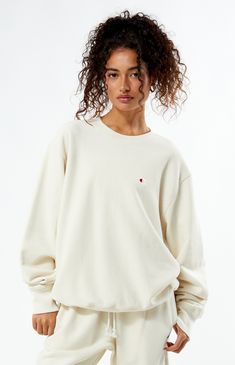 PacSun exclusive! Elevate your casual wardrobe with the Champion x PAC 1980 Crew Neck Sweatshirt, designed with ribbed side panels for a sleek silhouette. Featuring a classic crew neckline, a Pacific Sunwear 1980 soft-touch back graphic, and the iconic Champion "C" embroidery at the left chest, this sweatshirt effortlessly combines comfort and style for a timeless look.


	Solid color sweatshirt
	Long sleeves
	Crew neckline
	Champion C embroidery
	PacSun back graphic
	Ribbed side panels
	Ribbed trimming
	82% cotton, 18% polyester
	Machine washable
	Model is wearing a size medium
	Model measurements: 5’6” height, 30” bust, 25.5” waist, 36.5” hip Champion Clothing, Pullovers Outfit, Just Style, Champion Sweatshirt, Women Hoodies Sweatshirts, White Sweatshirt, Who What Wear, Comfy Outfits, Casual Wardrobe