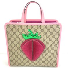 * Beige/Ebony Gg Supreme Coated Canvas Exterior With Pink Leather Trim * 3d Strawberry On Front * Magnetic Snap Closure * Double Leather Top Handles With Apprx. 3.5" Drop * Measurements: 11" L X 10" H X 4" D (Medium Size) * Made In Italy! * Pink Fabric Lining * One Open Pocket * Gucci Code (In The Bag): #630589 498879 * Bag Includes Gucci Care Books, Gucci Tag, And Gucci Dust Bag. 3d Strawberry, Brown Tote Bag, Gucci Monogram, Gucci Tote, Gucci Bamboo, Brown Tote, Gucci Leather, In The Bag, Leather Handbags Tote