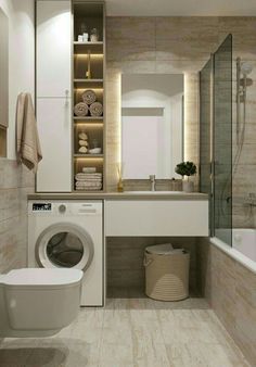 a washer and dryer in a bathroom next to a toilet with towels on the shelf