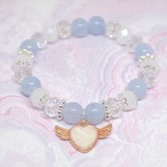 a bracelet with angel wings and blue beads