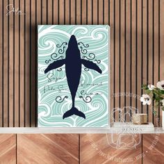 a whale with waves on it's back in front of a wooden wall