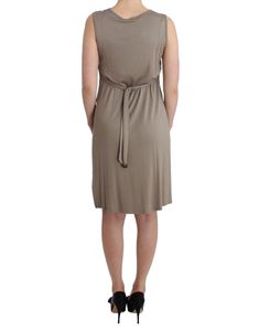 Elevate your wardrobe with this stunning new-with-tags sheath dress by Roccobarocco. Its knee-length cut and sleeveless design lend it a chic, timeless silhouette, perfect for various occasions. Adorned with studded detailing, this piece also features an elegant round neckline and includes a tie around the waist for a flattering fit. Accompanied by original tags and a branded store bag, this dress exudes luxury and sophistication. Color: Beige Material: Viscose Country of Origin: IT Knee Length Dress, Gorgeous Dresses, Sheath Dress, Jimmy Choo, Round Neckline, Versace, Knee Length, Dolce And Gabbana, Dresses For Work