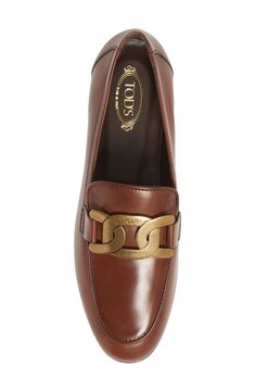 This beautifully shaped Italian leather loafer is polished to a sophisticated shine and adorned with a brassy fixed-chain buckle. Leather upper, lining and sole Made in Italy Women's Designer Shoes Gold Loafers With Leather Sole And Calf Leather, Gold Calf Leather Loafers With Leather Sole, Gold Luxury Loafers For Office, Luxury Gold Calf Leather Loafers, Luxury Gold Loafers For Office, Luxury Gold Loafers In Calf Leather, Gold Luxury Office Loafers, Formal Leather Loafers With Metal Logo, Classic Gold Loafers For Work