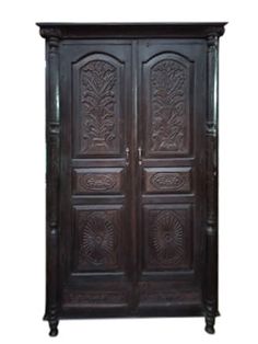 an old wooden armoire with carved designs on the front and side doors, isolated against a white background