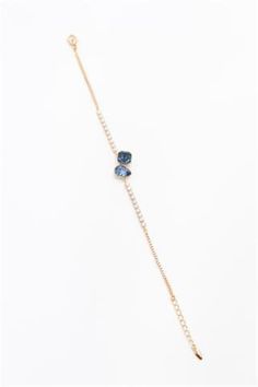 Introducing our stunning gold color and blue stone bracelet, meticulously designed for modern urban women who embrace both style and sophistication. Crafted with attention to detail, this elegant accessory effortlessly captures the essence of contemporary fashion. The shimmering gold color beautifully complements the vibrant blue stone, creating a mesmerizing combination that is sure to turn heads. Whether worn for a night out or simply to elevate your everyday ensemble, this bracelet adds a touch of glamour to any look. Treat yourself or surprise a loved one with this captivating piece, designed to make a statement and elevate your jewelry collection. Elegant Adjustable Blue Gold Bracelet, Elegant Blue Adjustable Gold Bracelet, Elegant Blue Bracelets With Adjustable Chain, Adjustable Blue Chain Bracelet For Party, Blue Stone Bracelet, Color Bracelet, Wedding Jewelry Bracelets, Modern Urban, Elegant Accessories