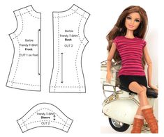 a doll sitting on top of a motor scooter next to a sewing pattern