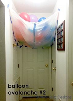 the balloon is hanging from the ceiling above the door