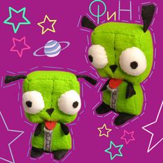 two green stuffed animals sitting next to each other on a purple background with stars around them