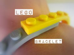 a close up of a person's wrist with a lego bracelet attached to it