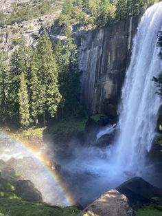 a waterfall with a rainbow in the middle