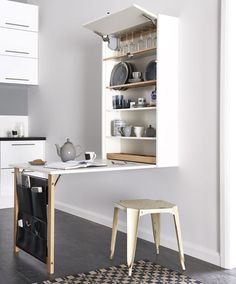 an image of a kitchen with white cupboards and counter tops in the middle of it