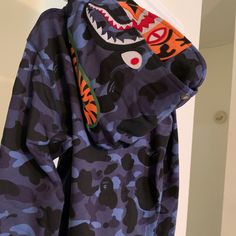 Bape Blue Camo Tiger Shark Wide Full Zip Double Hood Hoodie Large - New W Tags Brand Nw With Tags And Bag. Size Is Large ( Please Remember Japan Sizes Are Smaller Than Us Size) See Measurements Measurements Are 44" Around Chest And 26" Long From Top Of Shoulder To Bottom Of Hoodie Features Heavyweight Double Hood, See Photos Full Zip Jacket Syle Hoodie ( Two Zippers, One On The Bottom And One On The Top) White Jordan Hoodie, Blue Bape Hoodie, Bape Hoodie, Tiger Hoodie, Nike Pullover Hoodie, Shark Hoodie, Maroon Hoodie, Usa Sweatshirt, Tiger Shark