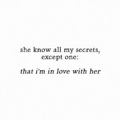 the words are written in black and white on a paper sheet that says she know all my secrets except one that i'm in love with her