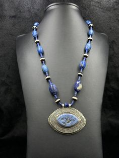 Beautiful Design Sterling Silver Vintage Unique Necklace With Banded Agate And Intaglio Lapis lazuli Stone From Afghanistan. Necklace Length 22 inches.  Shipping Payment Feedback & Return Policy 1 : We ship Monday to Friday Via Airmail Register Insured  With Tracking # takes 2 to 4 Weeks to Destination. 2 : Contact us if you did not receive your item after 4 weeks. 3 : We Accept Payment From Most of the Mainstream Payment Methods. 4 : In Any Inconvenience Case we do Accept Return and full Refund Handmade Blue Sodalite Necklaces, Artisan Carved Blue Jewelry, Artisan Lapis Lazuli Pendant Necklace, Blue Sodalite Pendant Necklace, Spiritual Blue Agate Necklace, Blue Amulet Style Necklace With Natural Stones, Blue Amulet Necklace With Large Pendant, Blue Amulet Necklaces With Natural Stones, Traditional Lapis Lazuli Beaded Necklace