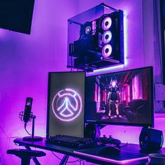 a desktop computer sitting on top of a desk in front of a monitor and speakers