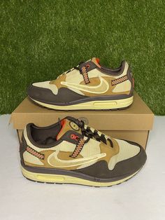 Elevate your shoe collection with these limited edition Nike Air Max 1 x Travis Scott Baroque Brown sneakers. The colorblock design and retro theme make them a versatile choice for both casual wear and activewear. These sneakers feature a lace-up closure and low top shoe shaft style, providing a comfortable fit for walking, running, and jogging. The synthetic upper material is durable and easy to maintain, while the fabric lining material and foam insole material provide added comfort. These sneakers have a standard shoe width and a rubber outsole material for better traction. With a 2021 year of manufacture and a style code of DO9392-200, these sneakers are a must-have for any sneaker enthusiast. Condition: Pre-owned Flaws: Markings Box: Original box All shoes are guaranteed to be 100% au Retro Nike Running Shoes With Boost Midsole, Retro Nike Custom Sneakers, Retro Sneakers With Air Max Cushioning And Round Toe, Casual Custom Sneakers With Air Max Cushioning For Outdoor, Retro Lace-up Custom Sneakers For Sports, Nike Retro Custom Sneakers For Sports, Custom Retro Sneakers With Cushioned Footbed For Sports, Retro Custom Sneakers With Cushioned Footbed For Sports, Retro Sneakers With Air Max Cushioning For Sports