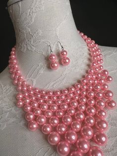 Pearl Beaded Necklace in a choice of 7 colours Main picture shows Pink, see other listings for detailed images of other colours Handmade, these necklaces and earrings are beautiful to wear with dresses or tops, at festivals, parties, occasions or on holiday. Has a chain and clasp to make the necklace adjustable to sit where you prefer Price per set of necklace and earrings. Pink Pearl Jewelry With Dangling Beads, Pink Jewelry Sets With Round Beads For Parties, Pink Round Beads Jewelry Sets For Party, Pink Pearl Necklace With Round Beads For Party, Pink Pearl Beads For Jewelry Making, Pink Pearl Necklace With High Luster, Pink Pearl Jewelry With 8mm Beads, Elegant Pink Rose Quartz Beaded Necklace, Rose-colored Rose Design Round Necklaces